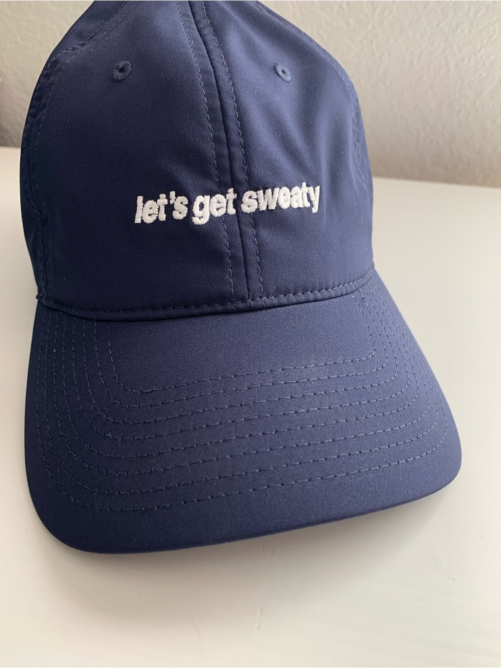 The Game Navy and White Embroidered Baseball Cap Let’s Get Sweaty